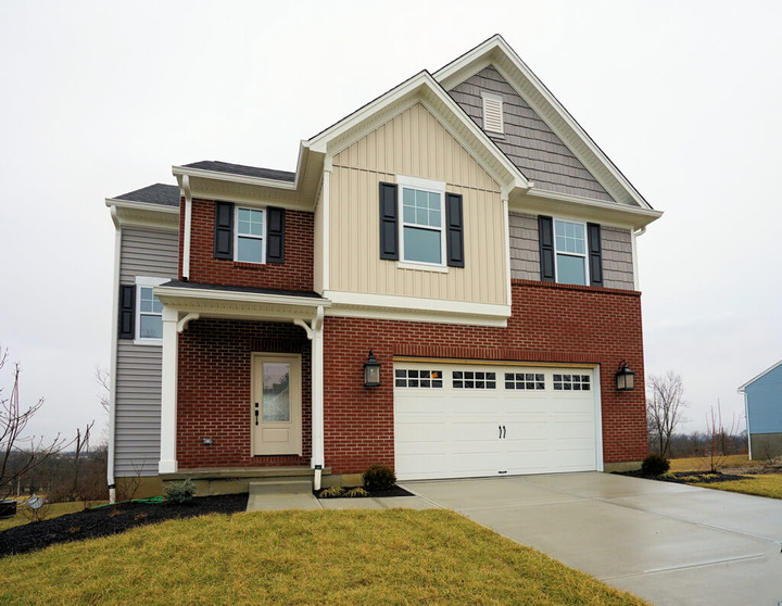 exterior of custom home with brick and multi-colored paneling by Chris Gorman Homes in Cincinnati, Ohio