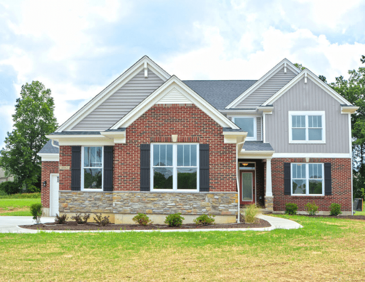exterior of custom home with brick and paneling by Chirs Gorman homes in Cincinnati, Ohio